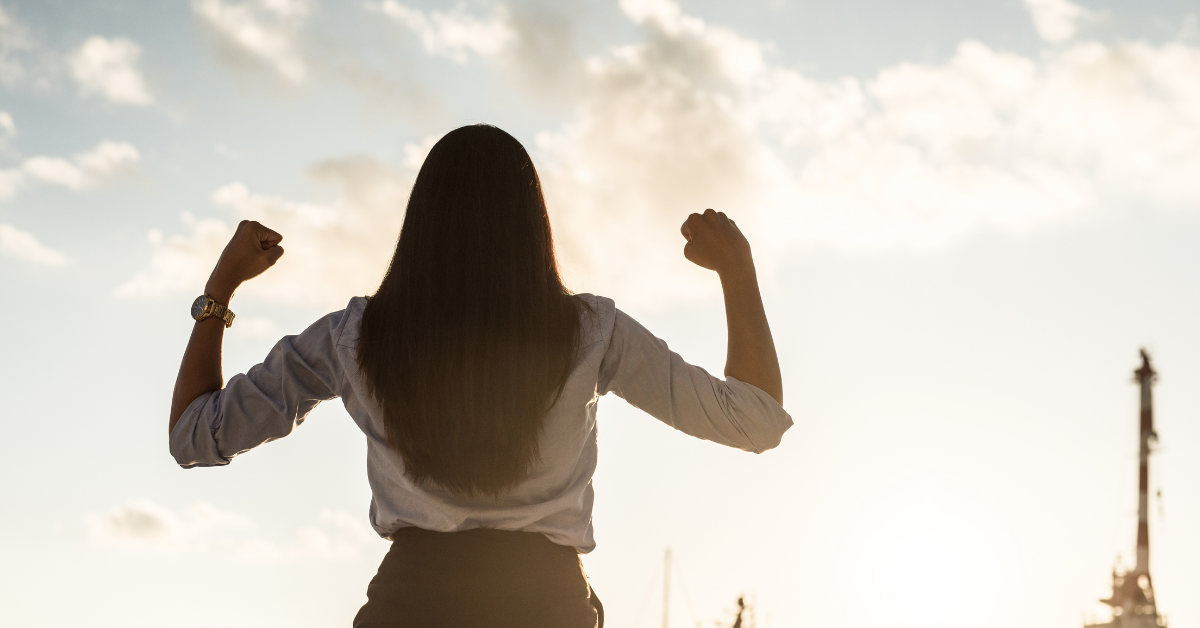 US expat makes power pose after successfully catching up on taxes by partnering with Bright!Tax to complete the Streamlined Filing Compliance Procedures