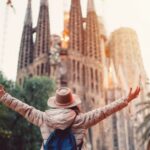 US expat standing in front of the Sagrada Familia in Barcelona.